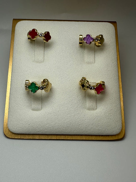 Unleash your inner sparkle with this stunning collection of ear cuffs Featuring four unique designs, each adorned with vibrant gemstones and dazzling accents, this set is perfect for adding a touch of glamour to any look.