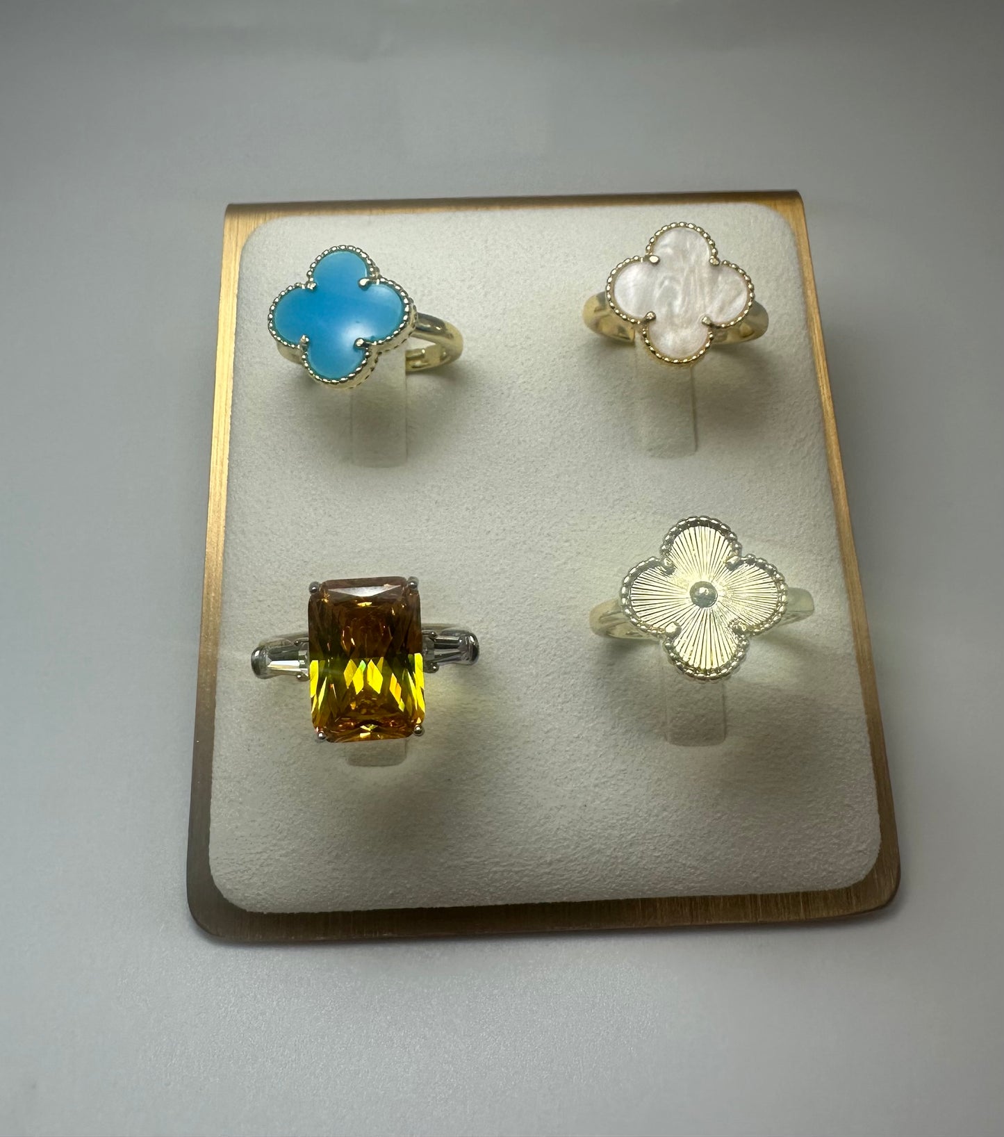 Discover the epitome of elegance with this stunning collection of gold rings! Featuring four unique designs, each crafted with exquisite detail and vibrant gemstones. This set includes: